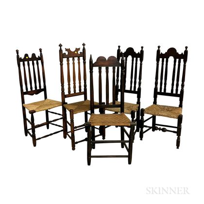 Five Black-painted Banister-back Side Chairs. Estimate $250-350