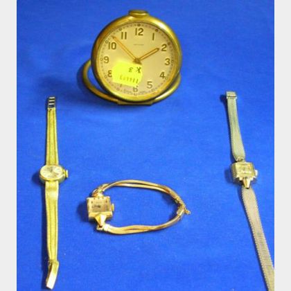 Three Gold Lady's Wristwatches and a Grant A. Peacock Travel Alarm Clock