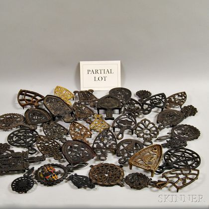 Approximately Forty-six Cast Iron and Brass Trivets