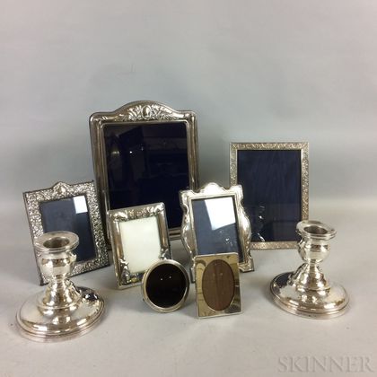 Seven Sterling Silver Frames and a Pair of Silver-plated Candlesticks