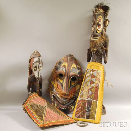 Four Carved African/Oceanic Polychrome Wood Figure Masks and Two Bark Bags