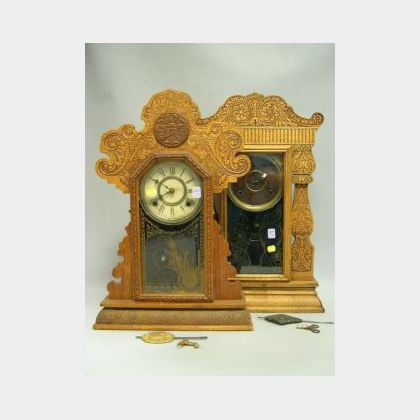 Two Late Victorian Pressed Oak Gingerbread Shelf Clocks