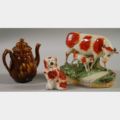 Two Staffordshire Figural Items and a Rockingham Glazed Teapot