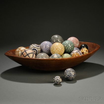 Collection of Ceramic Carpet Balls in an Oval Ash Bowl