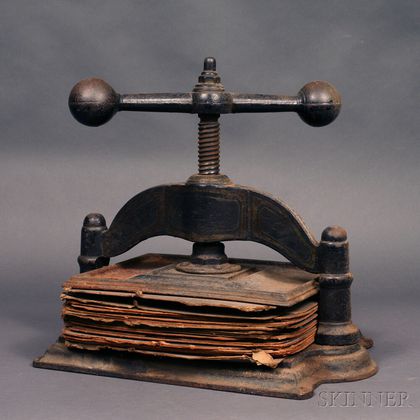 Lot - A cast iron book press, 19th century