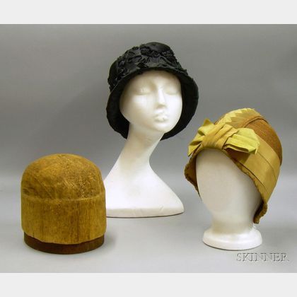 Two 1920s Straw and Silk Cloche Hats. 