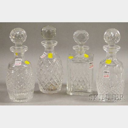 Four Colorless Cut Glass Decanters