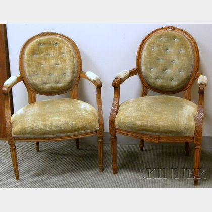 Near Pair of Louis XVI Style Upholstered Carved Beechwood Fauteuils. 