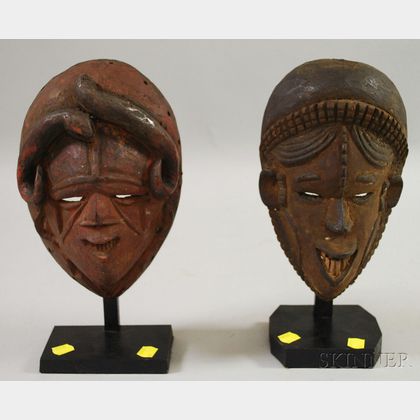 Two Igbo/Igbo-style Carved Wooden African Masks on Stands