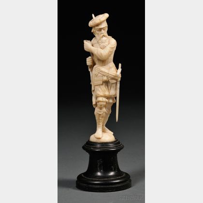 Carved Ivory Figure of a Man with a Sword