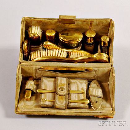 Cased and Brass-mounted Toiletry Set. Estimate $200-250