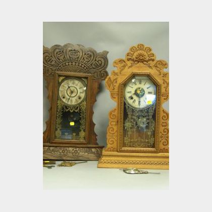 Two Late Victorian Pressed Oak Gingerbread Shelf Clocks. 